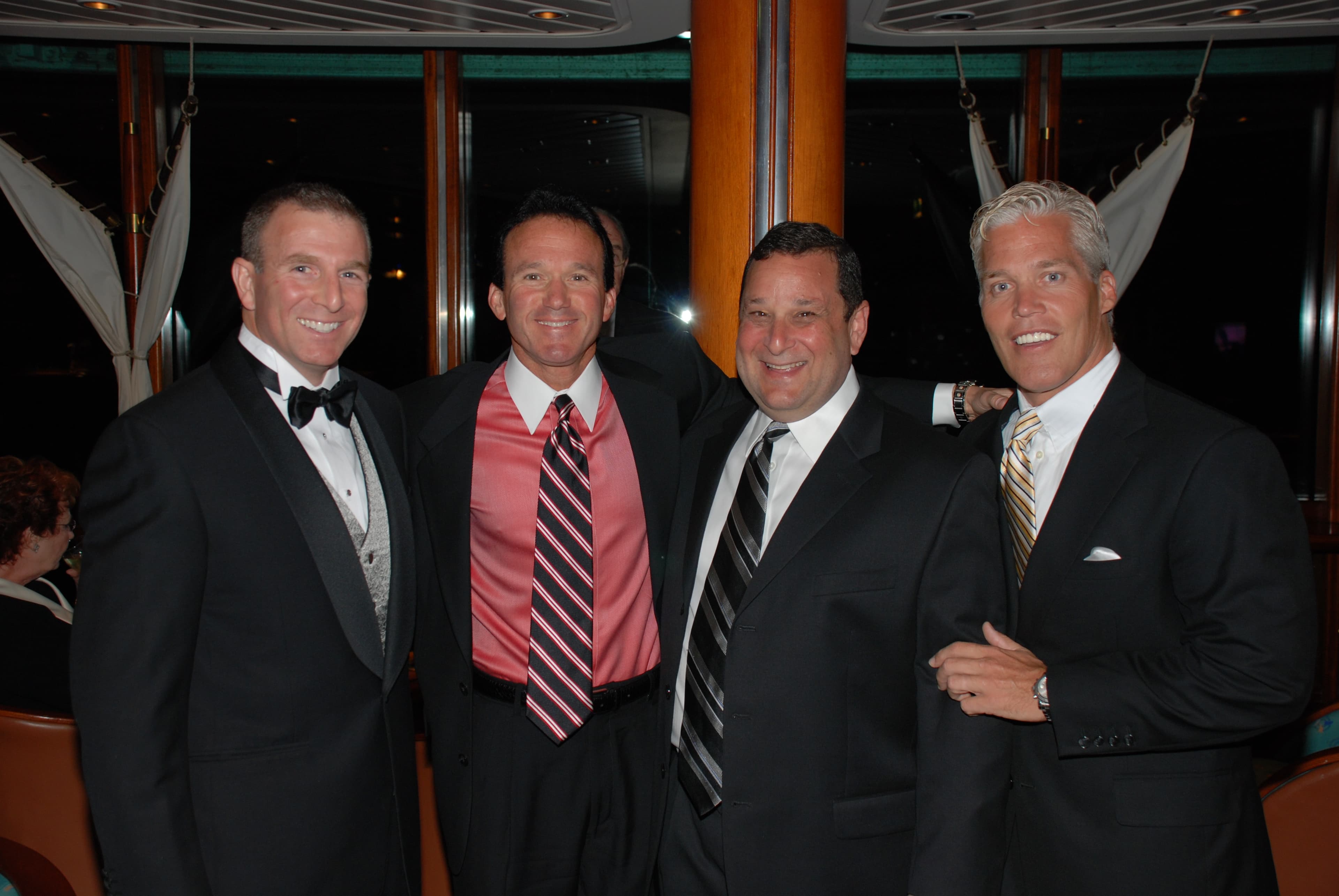 Larry arm in arm with friends